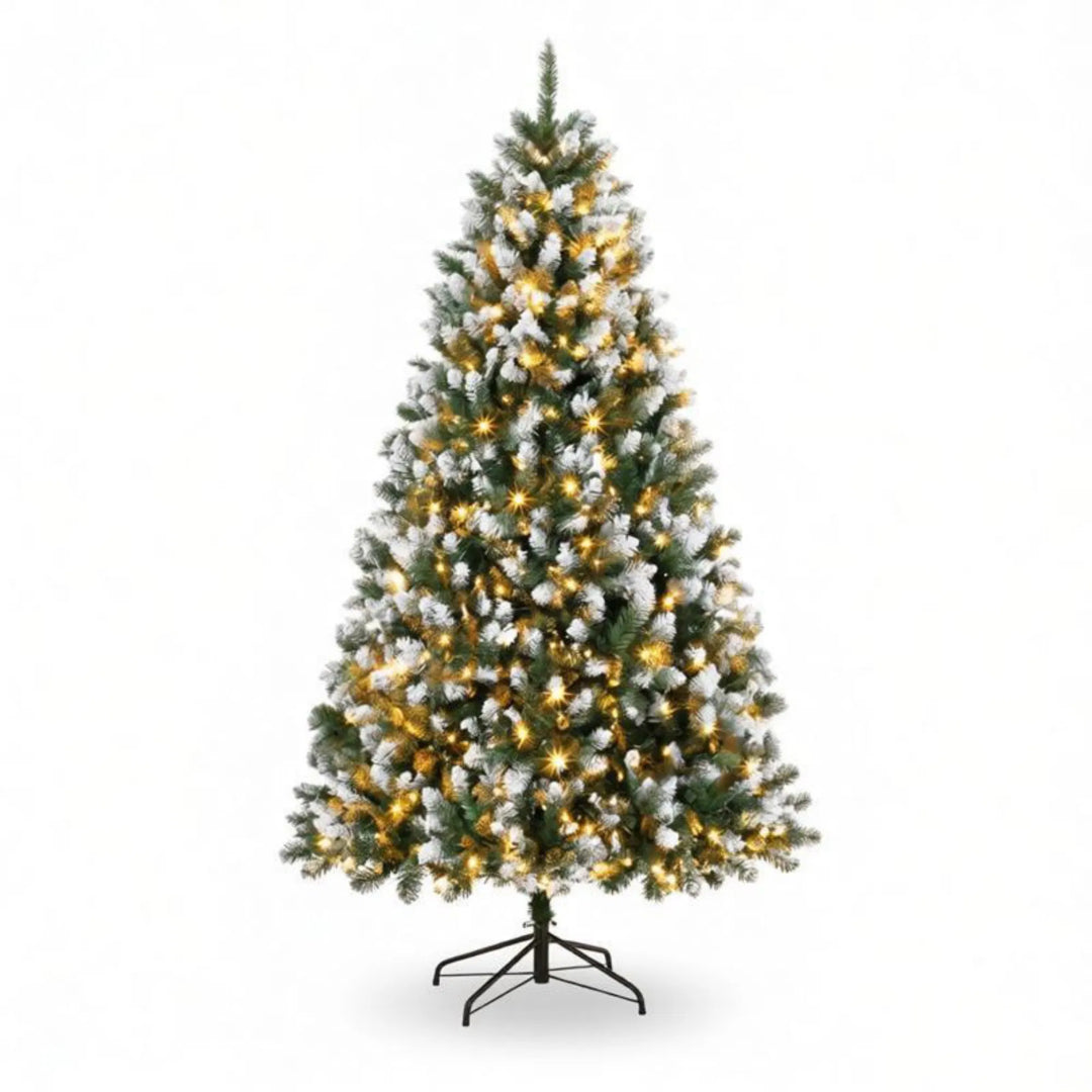 Tall snow tipped pre-lit Christmas tree