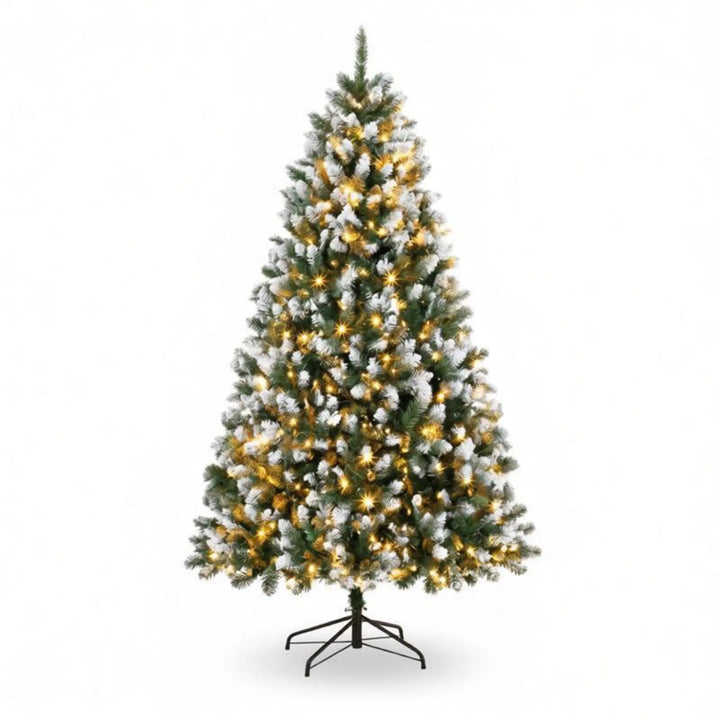 Tall snow tipped pre-lit Christmas tree