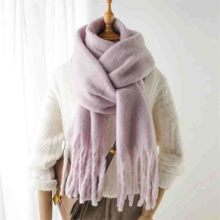 Woman wearing a fluffy mustard scarf