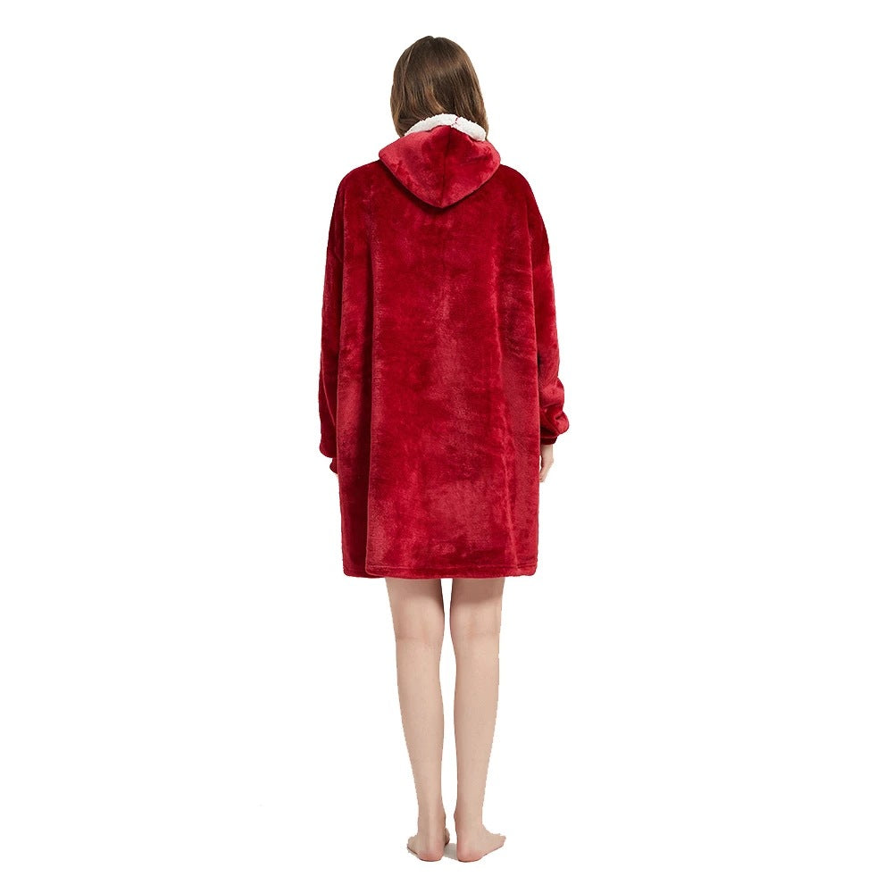 Person wearing an oversized blanket hoodie