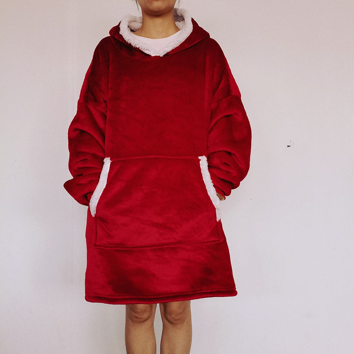 Person wearing an oversized blanket hoodie