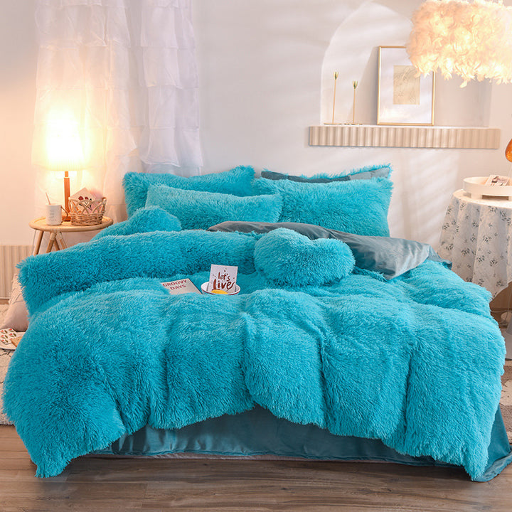Fluffy plush bedding set on a bed