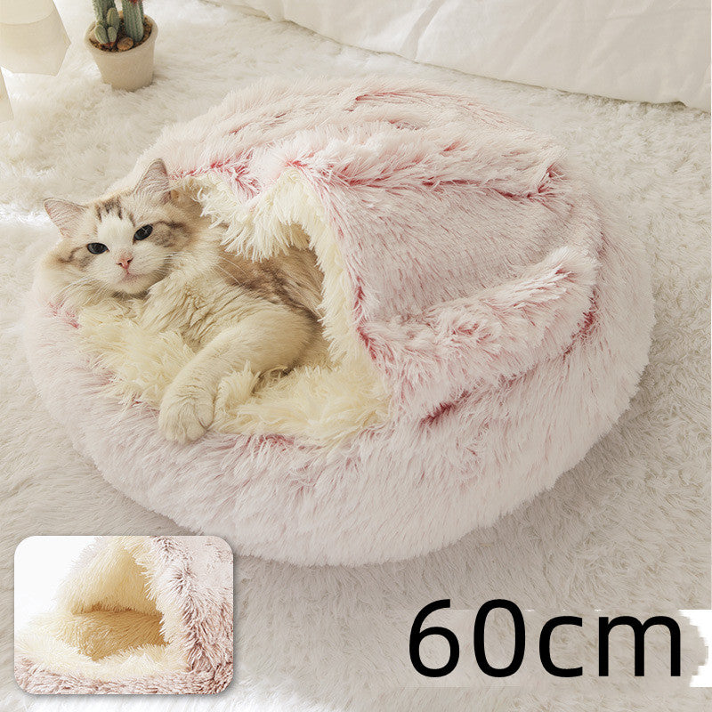 Cat curled up in a round plush bed with hood