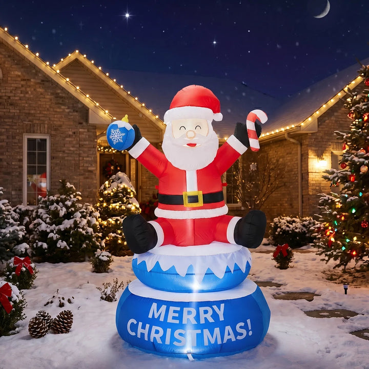 Inflatable lighted Santa on a rotating Merry Christmas base