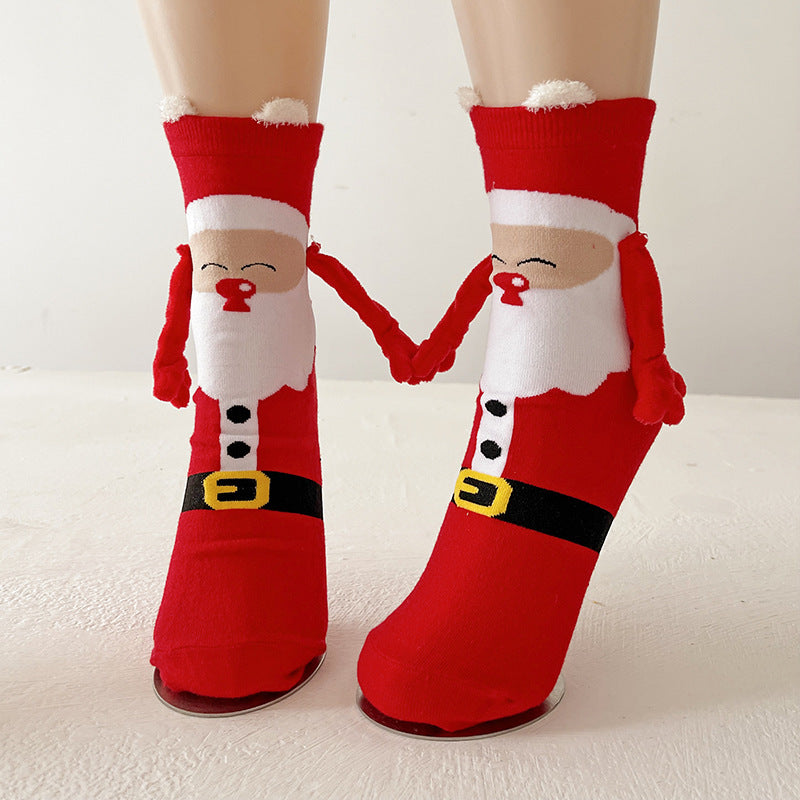 Couple wearing magnetic Christmas socks
