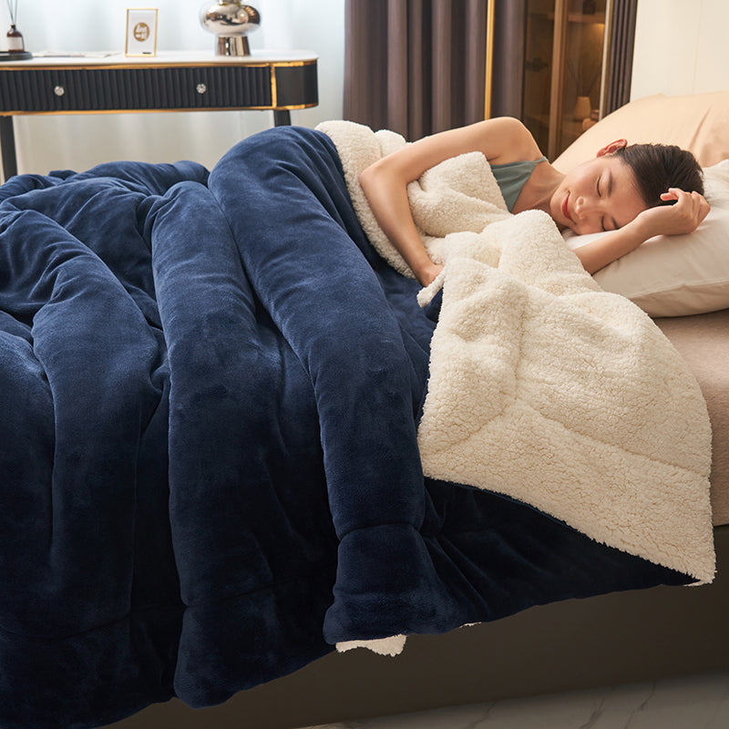 Reversible sherpa throw on a bed