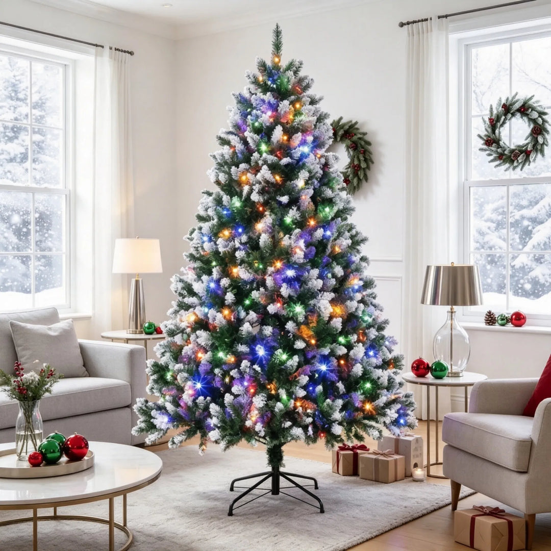 Tall snow tipped pre-lit Christmas tree