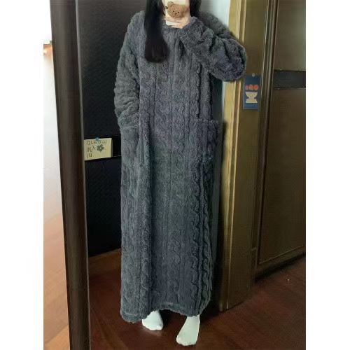Woman in a long pink fleece nightgown