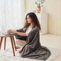 Fleece blanket worn as shawl with buttons