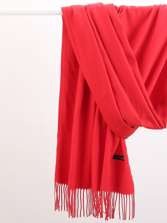 Woman wearing a soft wine red scarf