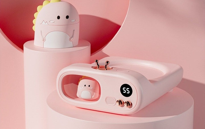 TV-shaped mug warmer with dinosaur figure