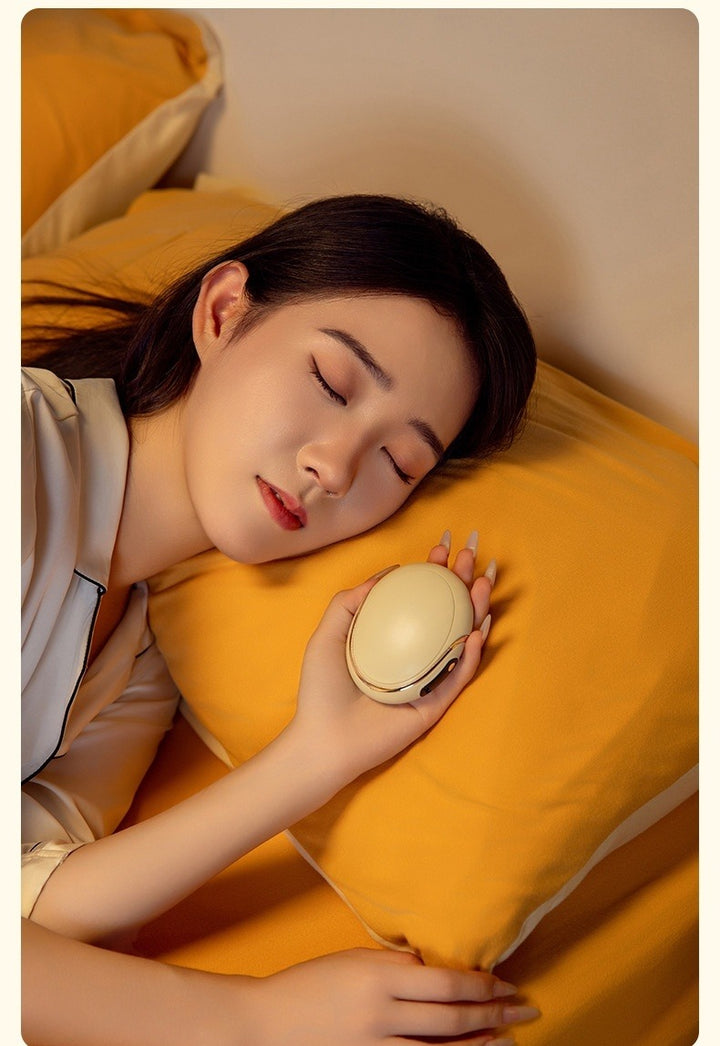 Pink egg-shaped rechargeable hand warmer