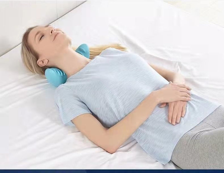 Contoured foam neck pillow with massage nodes
