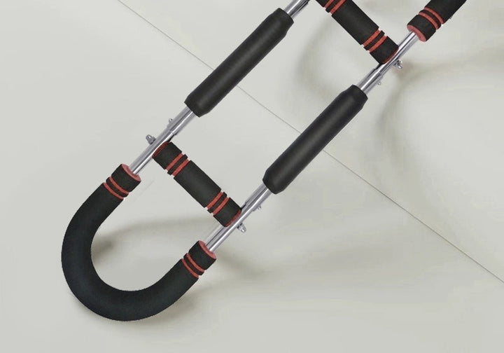 Man training with a U-shaped chest exerciser