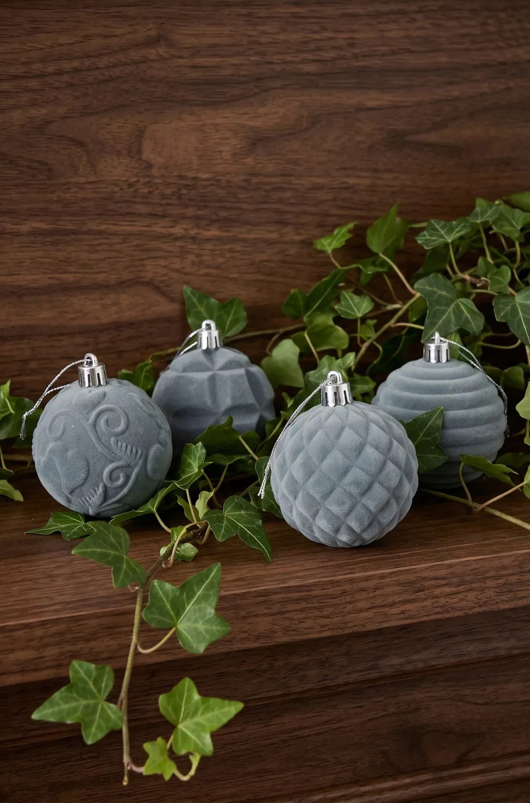 Gray velvet ball ornaments with silver caps