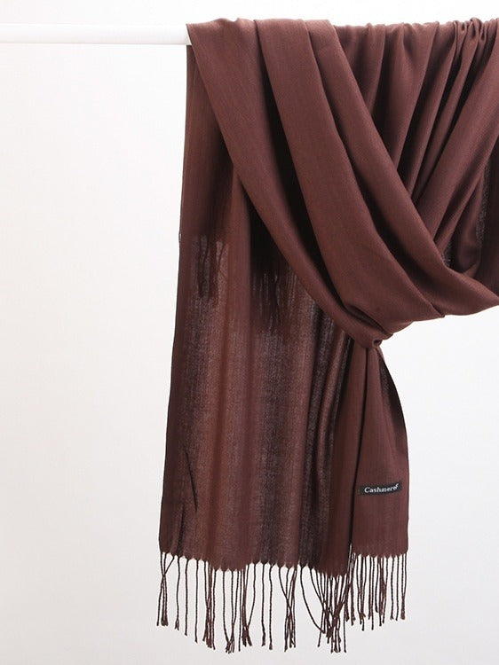 Woman wearing a soft wine red scarf