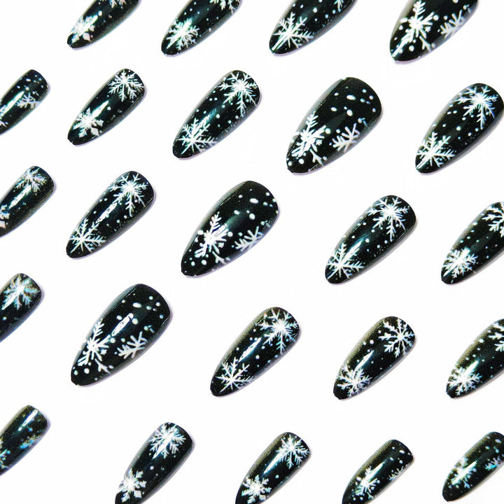 Winter Snowflake Nail Art Design on a Glossy Black Base