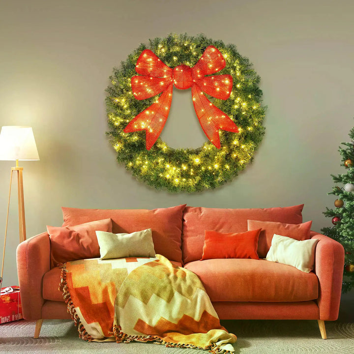 Giant lit Christmas wreath with red bow
