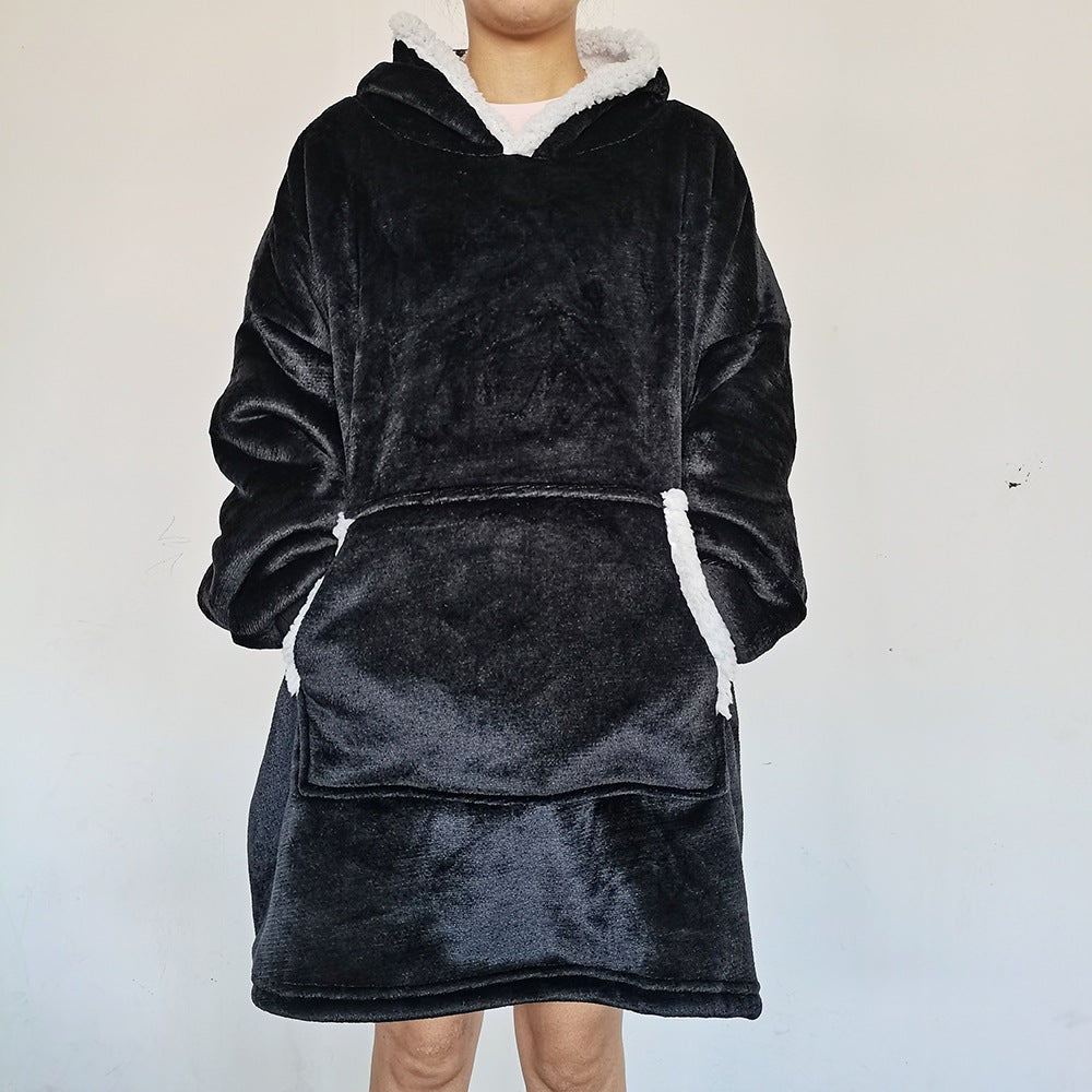 Person wearing an oversized blanket hoodie
