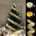 Gold ribbon fairy lights on Christmas tree