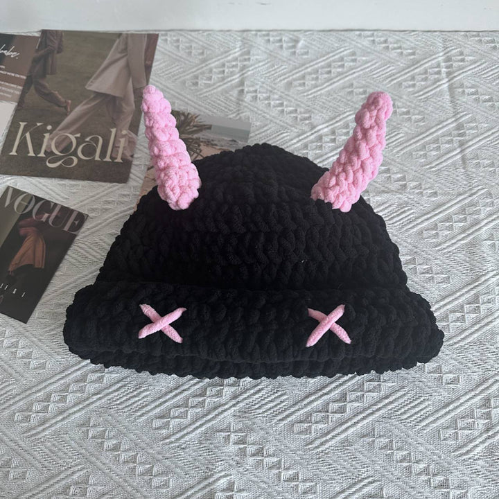 Black chunky crochet bucket hat with pink horns