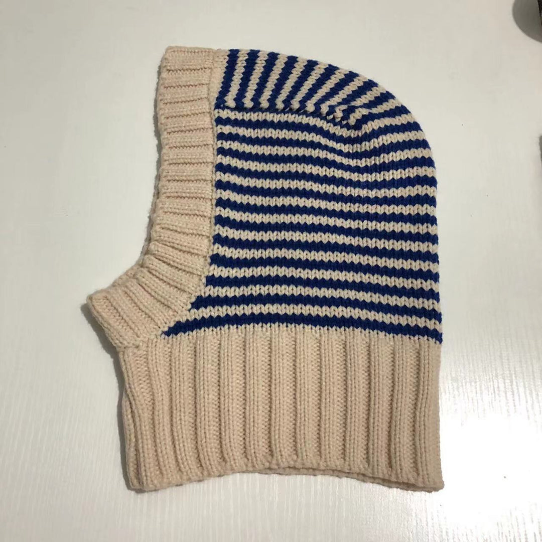 Person wearing striped knit balaclava hood