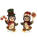 Two lighted penguins with candy canes