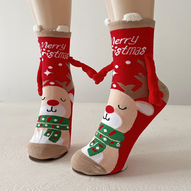 Couple wearing magnetic Christmas socks