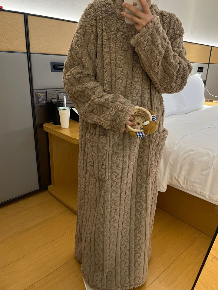 Woman in a long pink fleece nightgown