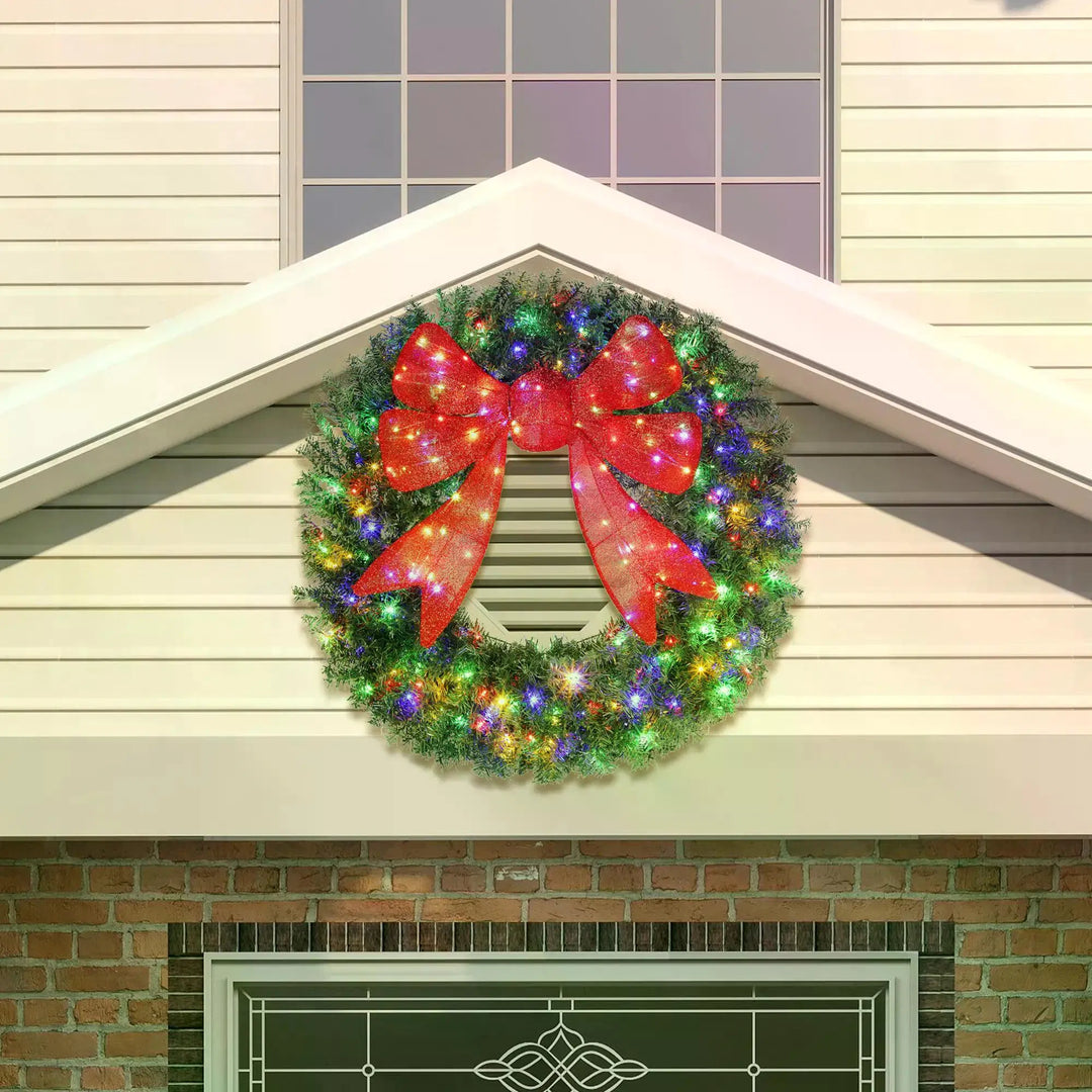 Giant lit Christmas wreath with red bow