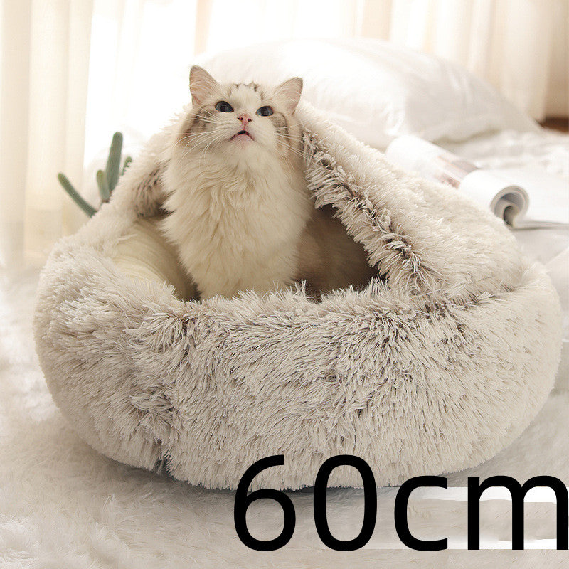 Cat curled up in a round plush bed with hood