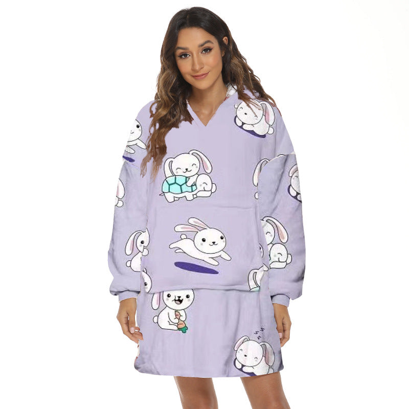 Person wearing oversized hooded blanket