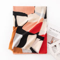 Woman in a mauve abstract print scarf