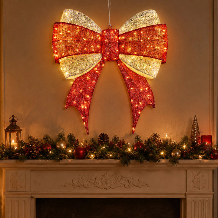 Large lighted red and gold Christmas bow