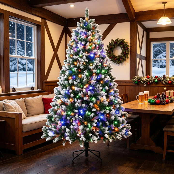 Tall snow tipped pre-lit Christmas tree