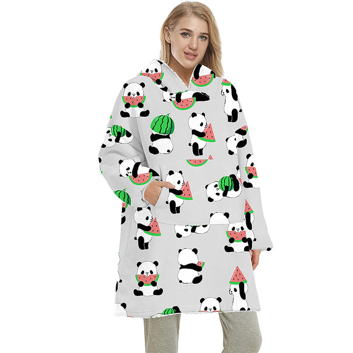 Person wearing oversized hooded blanket