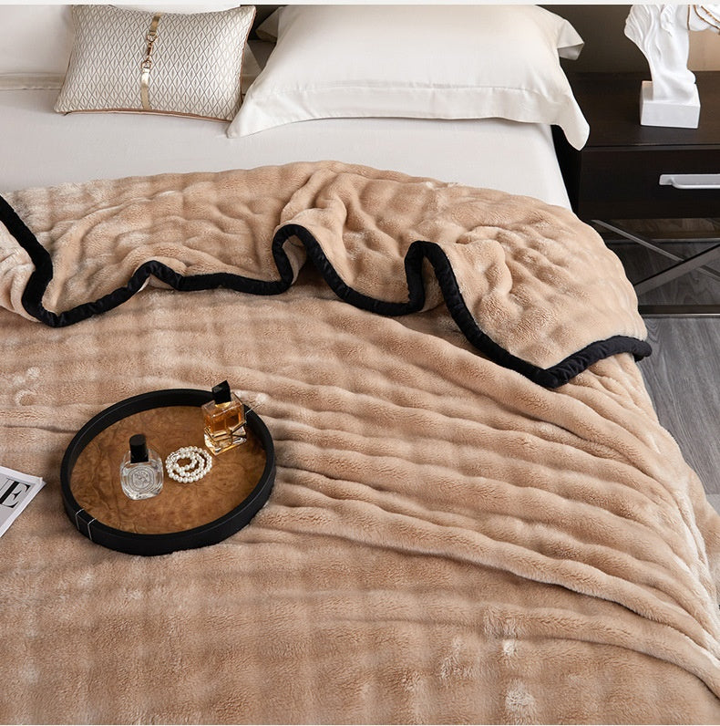 Bubble faux fur blanket with black trim