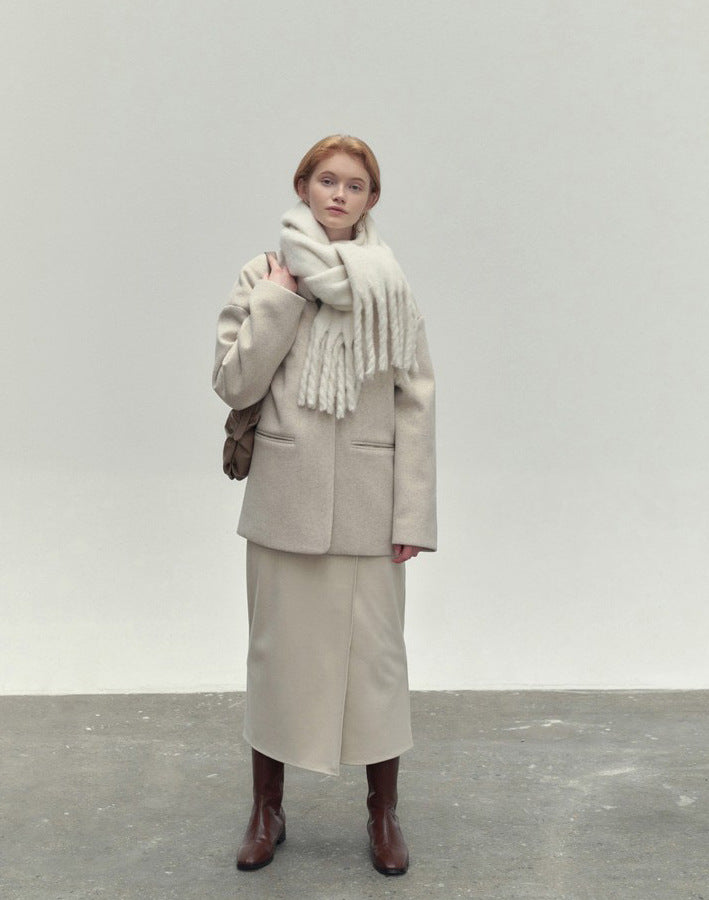 Woman wearing a long camel scarf