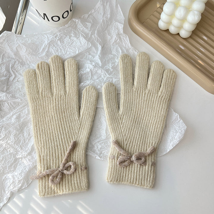 Pink ribbed knit gloves with bow