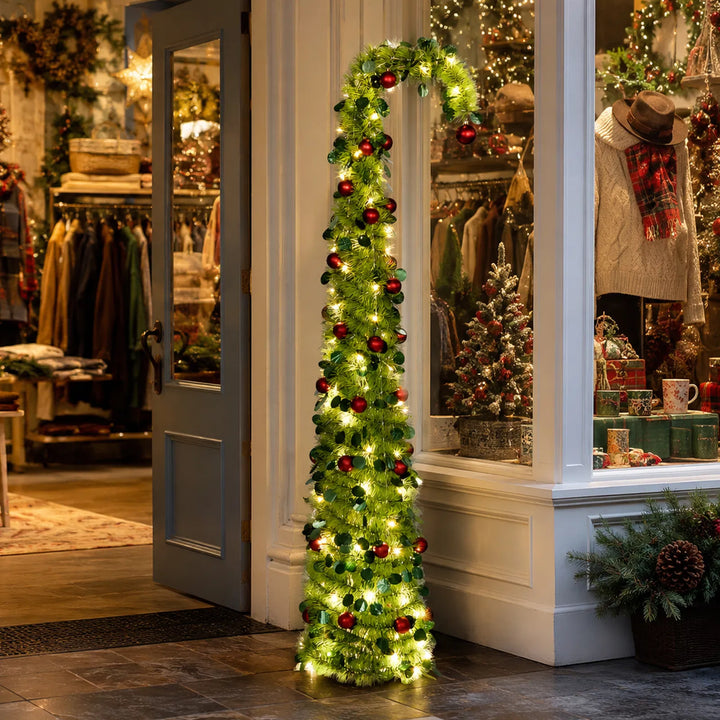 Green pop up Christmas tree with red ornaments