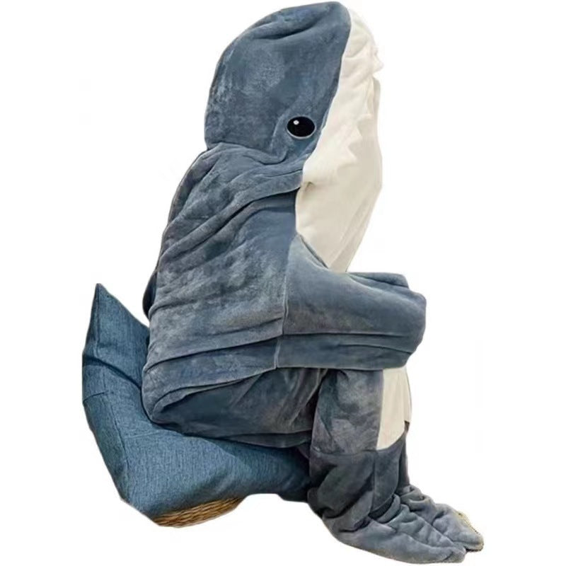 Person wearing a gray shark blanket hoodie