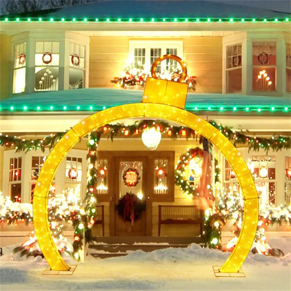 Lighted Christmas ornament archway at night