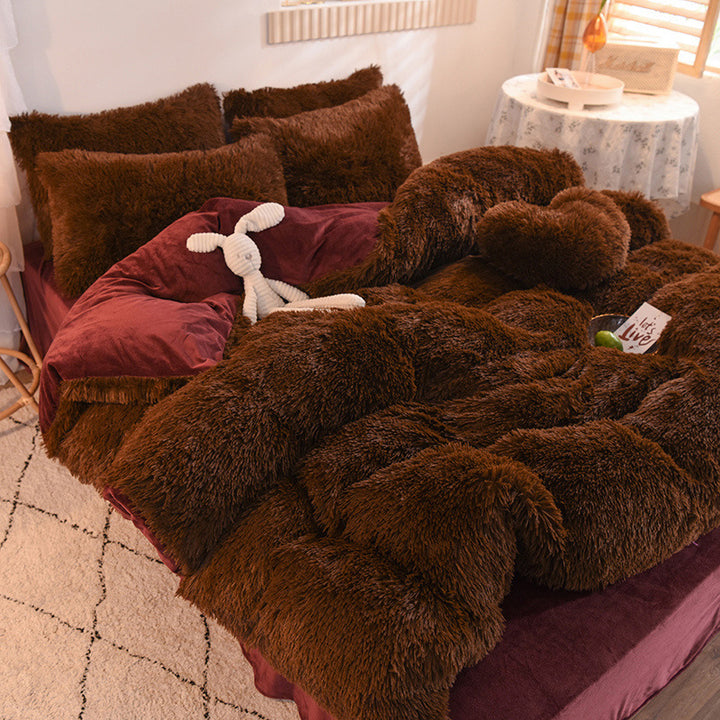Fluffy plush bedding set on a bed