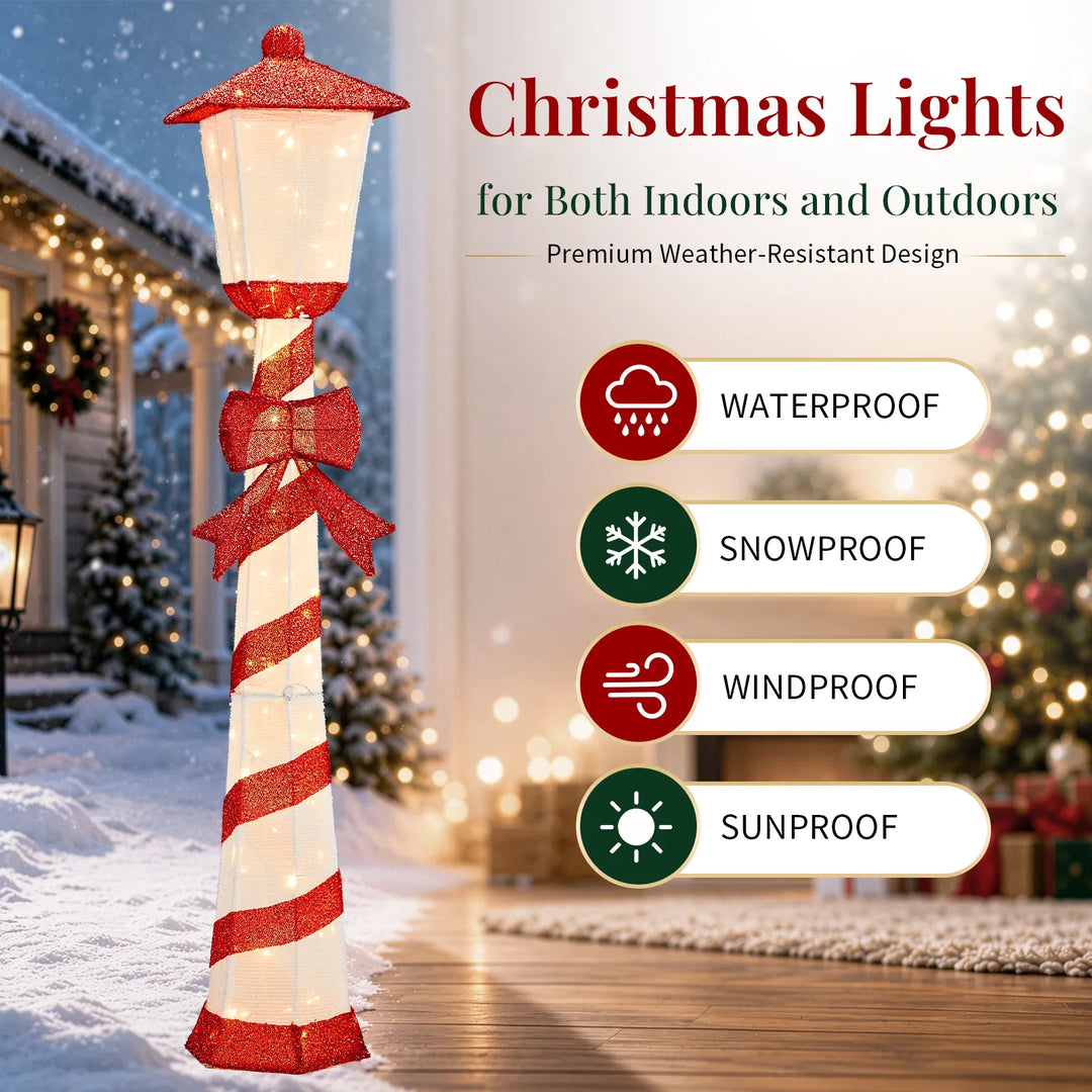 Lighted candy cane striped Christmas lamp post on a porch