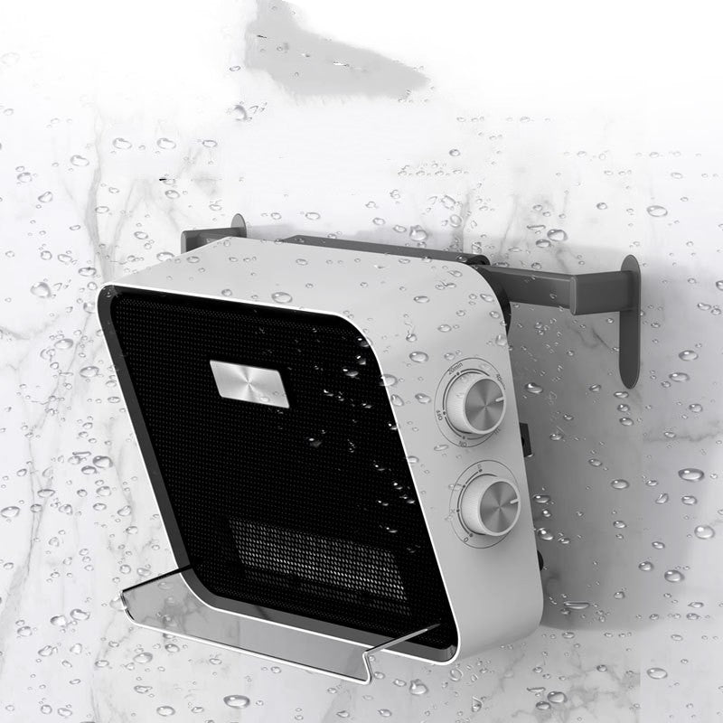White wall-mounted fan heater in a tiled bathroom
